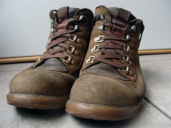 Pair of well-used brown hiking boots