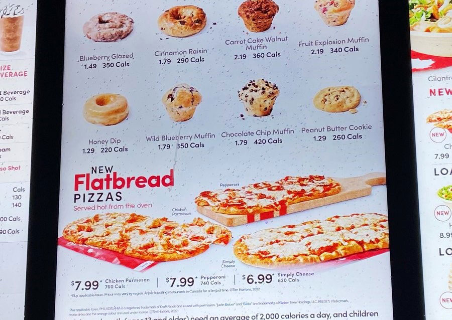 A photo of a Tim Hortons' menu sign that includes flatbread pizza.
