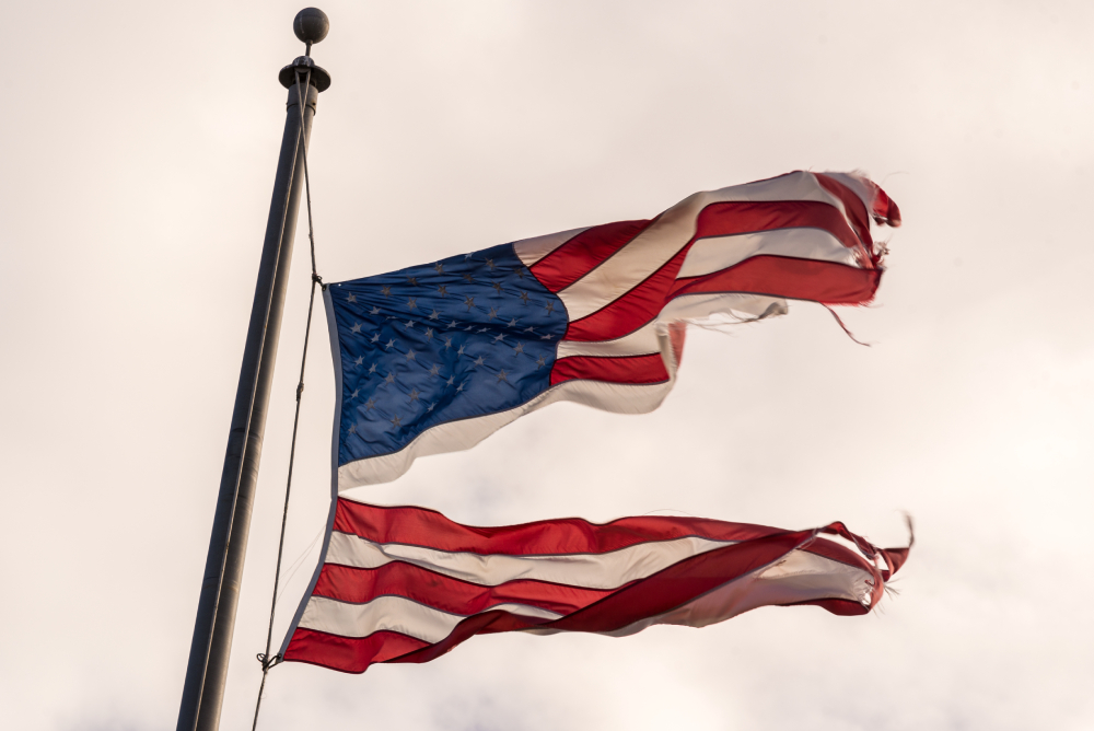 RippedAmericanFlagFlyingTorn.jpg