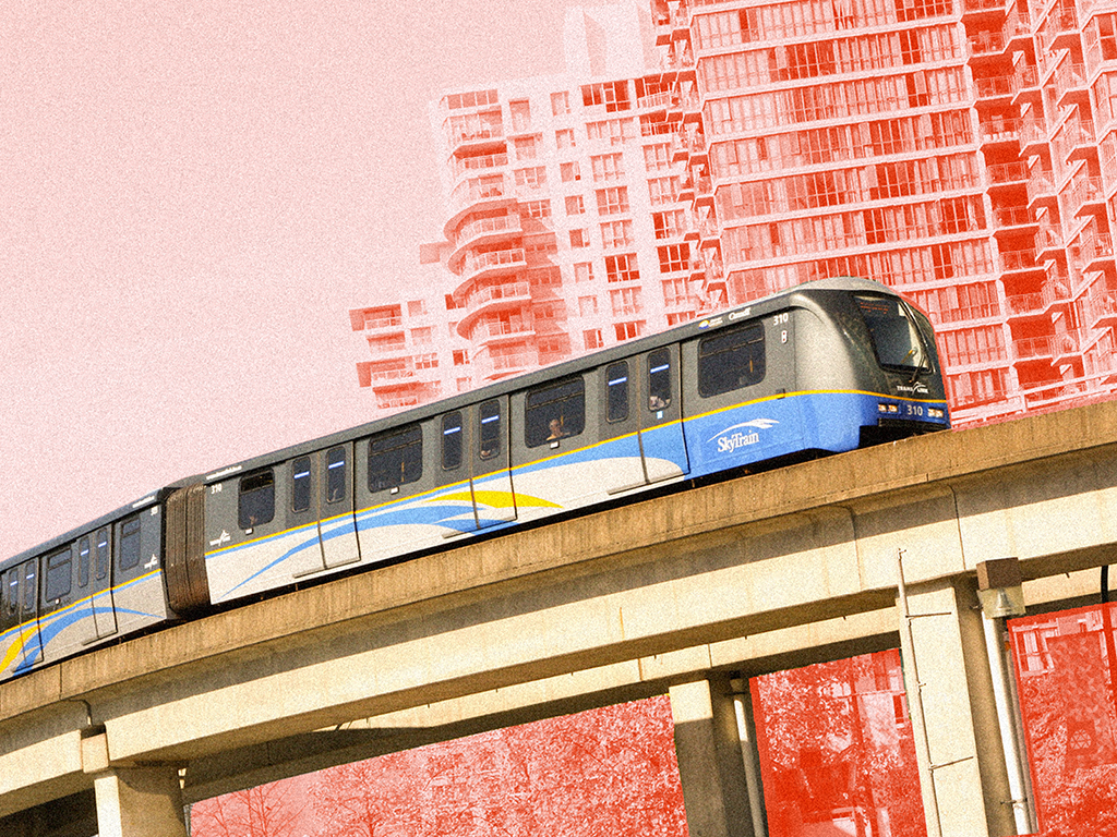 On a sunny day, a subway train travels on an elevated railway above ground with skyscrapers behind it.