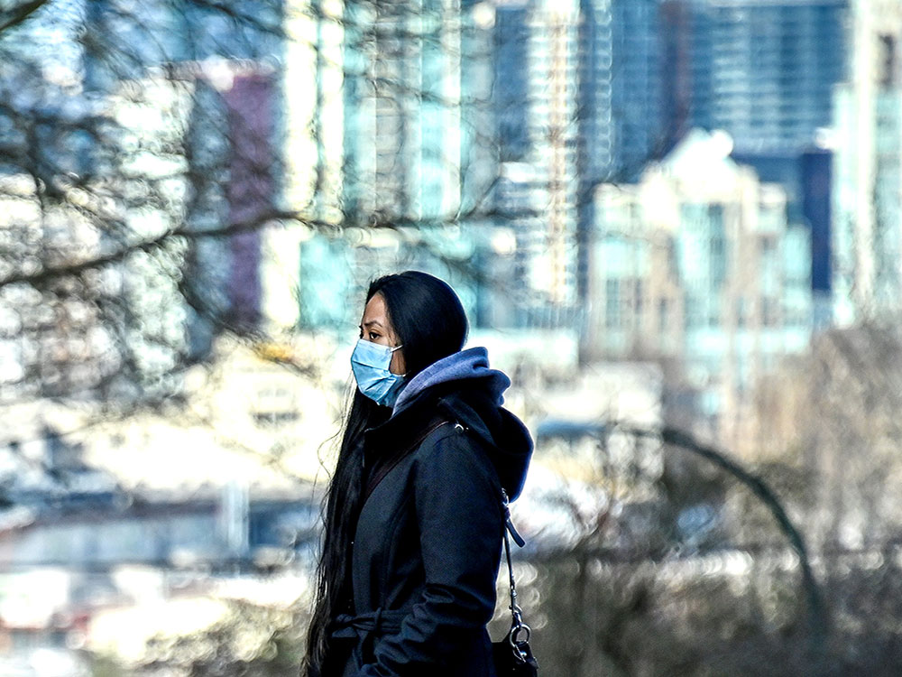 WomanMaskCityBuildings.jpg