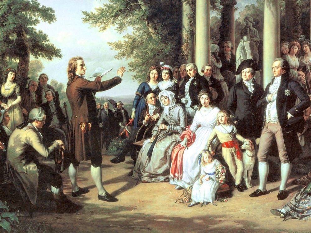 A painting depicts a man in a wig, stockings and long coat reading a book to an assembled crowd in an animated way.