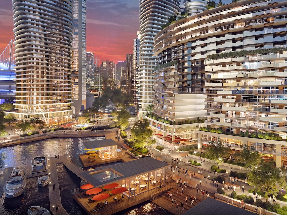 An artist’s rendering shows soaring buildings along the water, with yachts and pedestrian spaces.