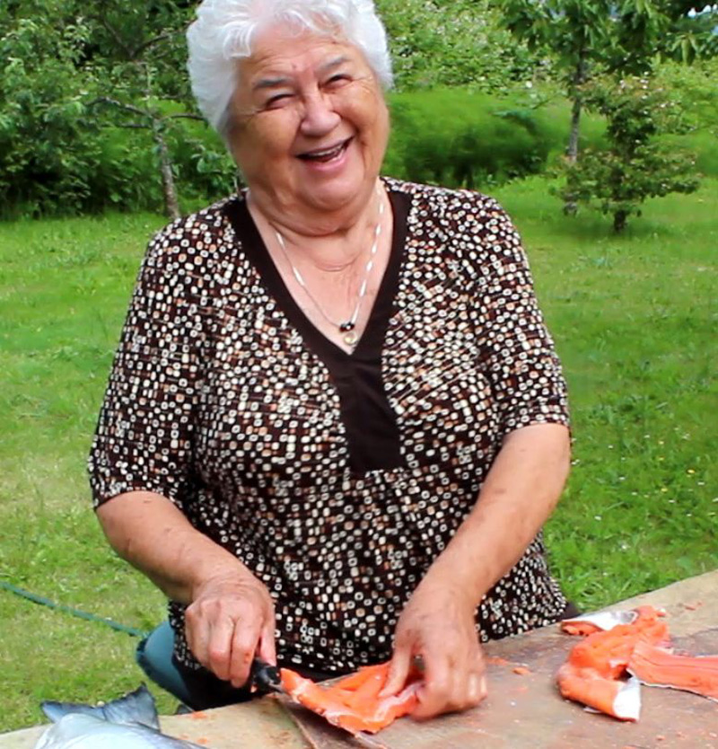 582px version of ElsiePaulCuttingSalmon.jpg