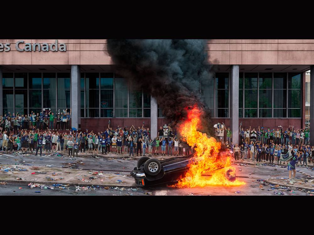 Depiction of the 2011 Stanley Cup riot in downtown Vancouver from above. Wide-angle.