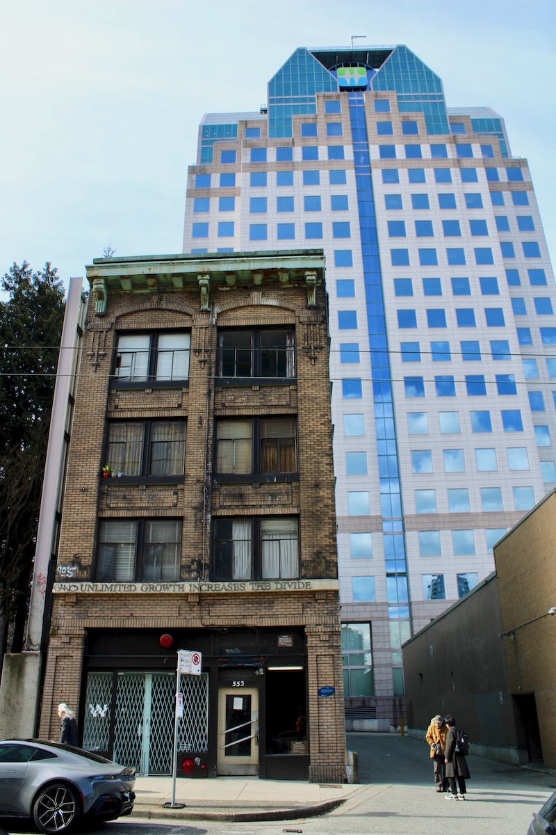 The BC Hydro building looms large over the four-storey Del Mar Hotel.