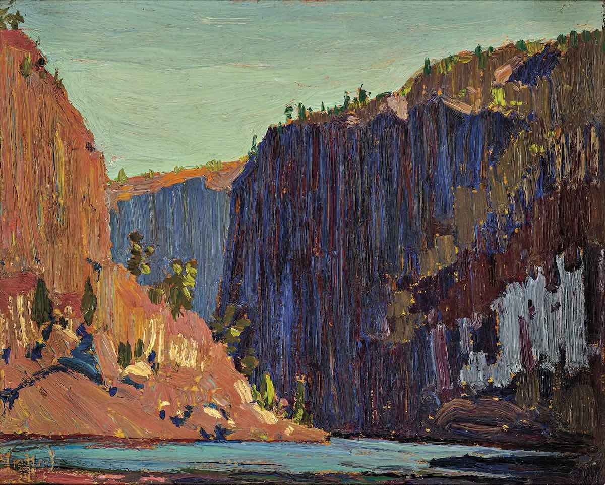 An oil painting of gorges with sheer vertical cliffs. On the left are terracotta-coloured hills, and on the right is a large, dark blue, rocky gorge. They rise above a light blue river.