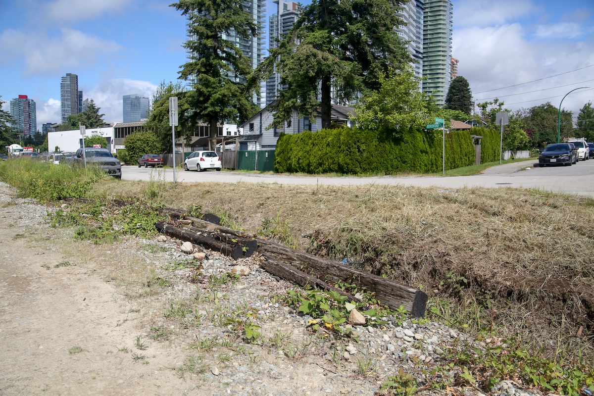 A few suspected railway ties lying next to a dusty path in the old interurban corridor.