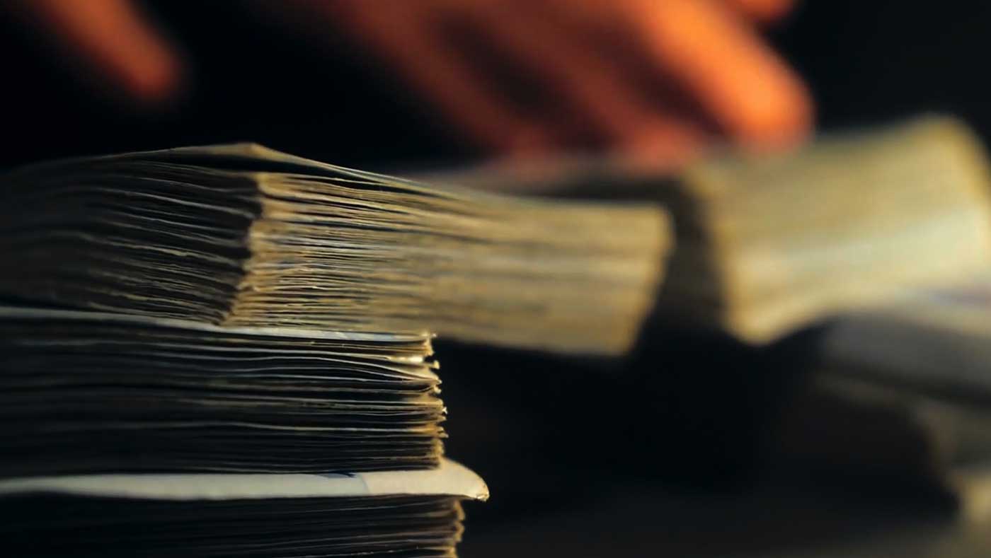 A close-up photograph of stacks of bills.