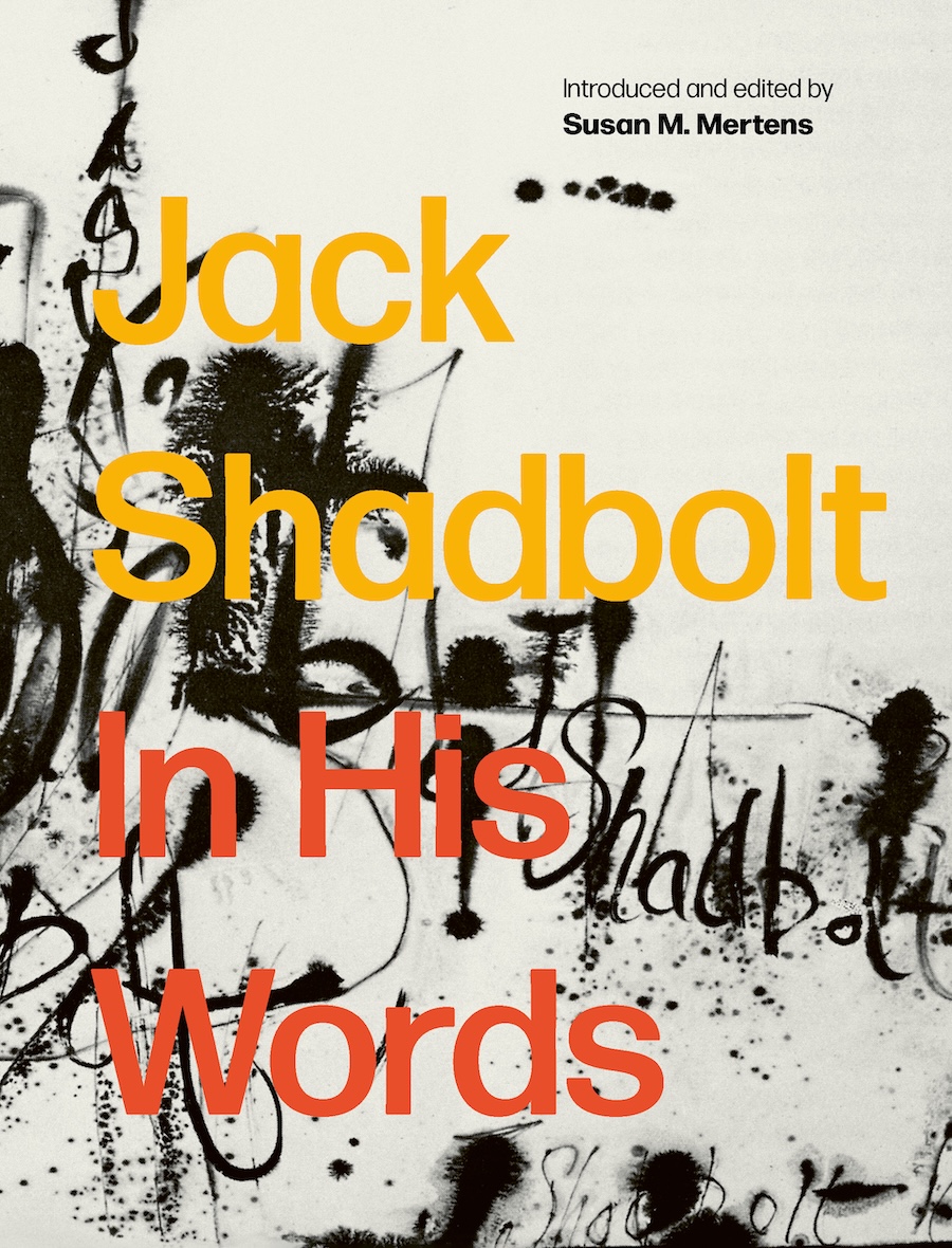 The book cover image for 'Jack Shadbolt: In His Words' features yellow and red sans-serif text against an abstract background featuring black paint against light grey.
