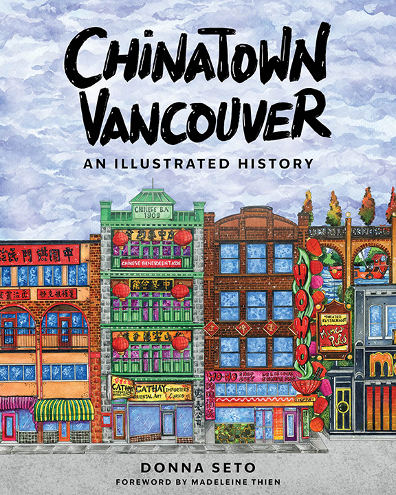 The book cover image for Donna Seto’s Chinatown, Vancouver features a colourful streetscape of tall illustrated buildings close together. They stand next to each other against a blue sky with white fluffy clouds, and the black title text is bold and made to look as though it is hand painted.