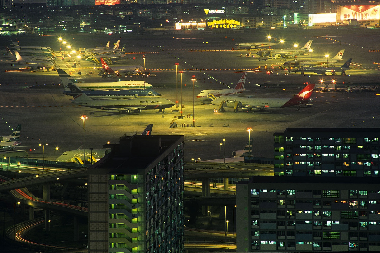 Planes are grounded at night in an airport in Hong Kong.