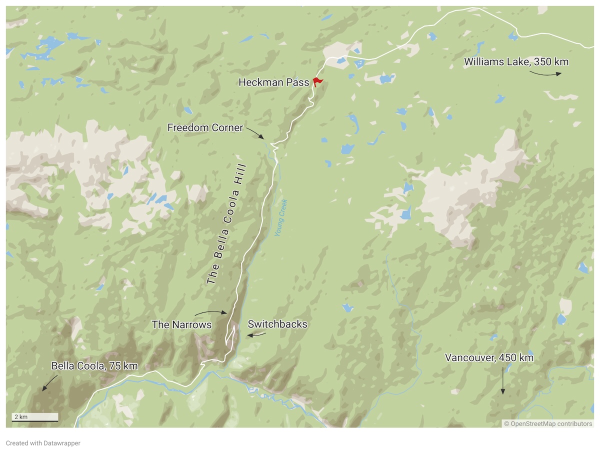 A map shows a straight road running up the middle labelled &lsquo;The Bella Coola Hill.&rsquo; At the top is a red flag labelled &lsquo;Heckman Pass.&rsquo;