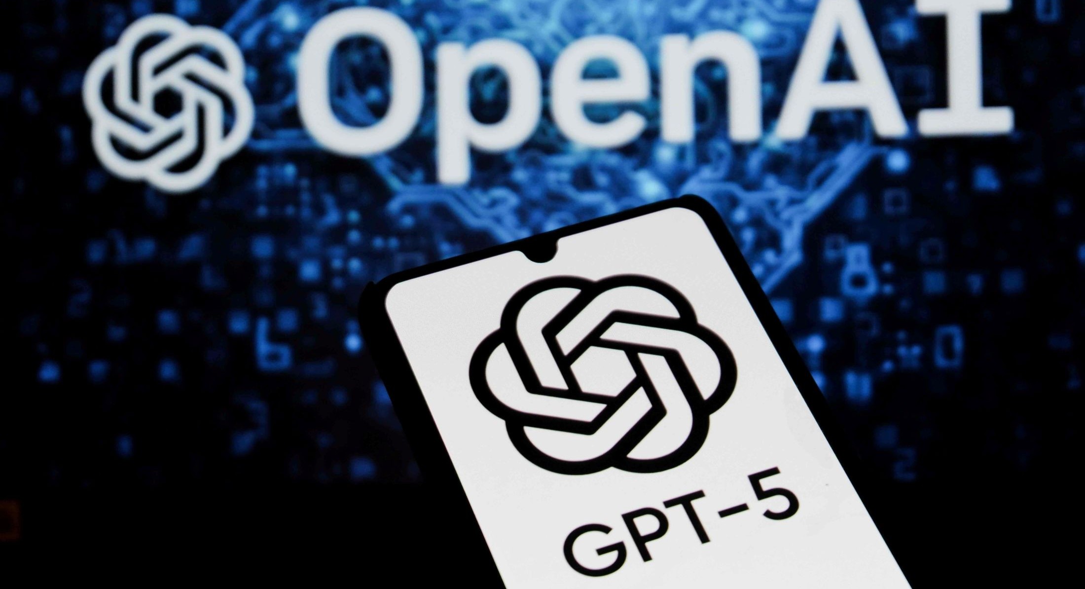 A digital illustration features the OpenAI logo in white text against a black background, and a smartphone with a white screen against which the black GPT-5 logo sits.