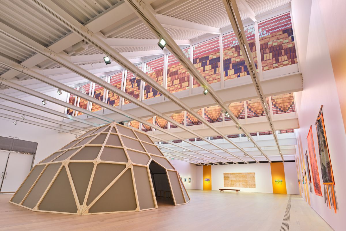 The &lsquo;Kekuli&rsquo;-inspired structure is in the foreground, with other works of Willard&rsquo;s art visible on the walls and skylights. 