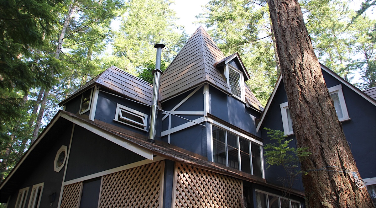 The gabled, blue cottage from the outside.
