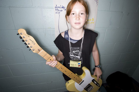 Girl with guitar at rock camp