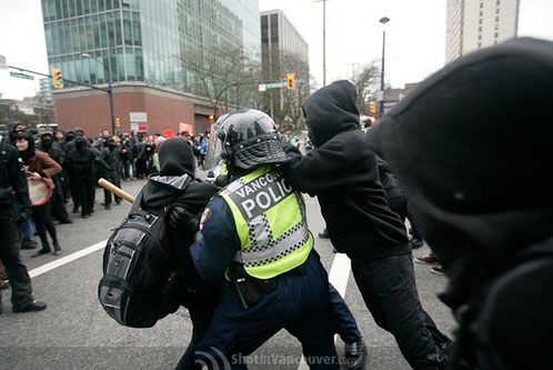 5_protest_attackingpolice.jpg