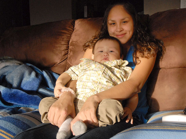 Native youth Becky Martin with child