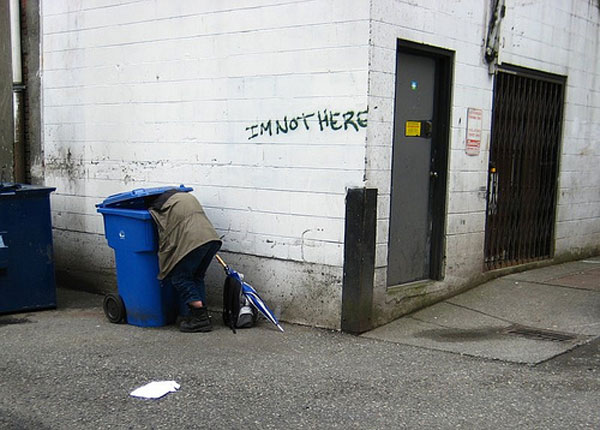 Dumpster diver in alley