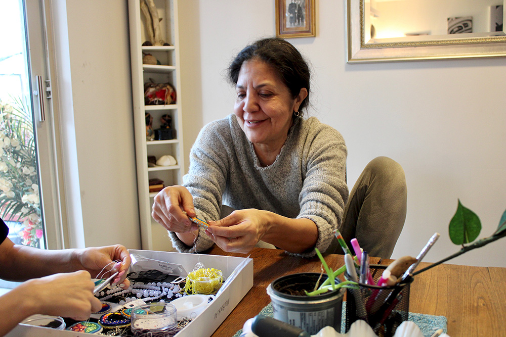 WomanBeadsTable.jpg