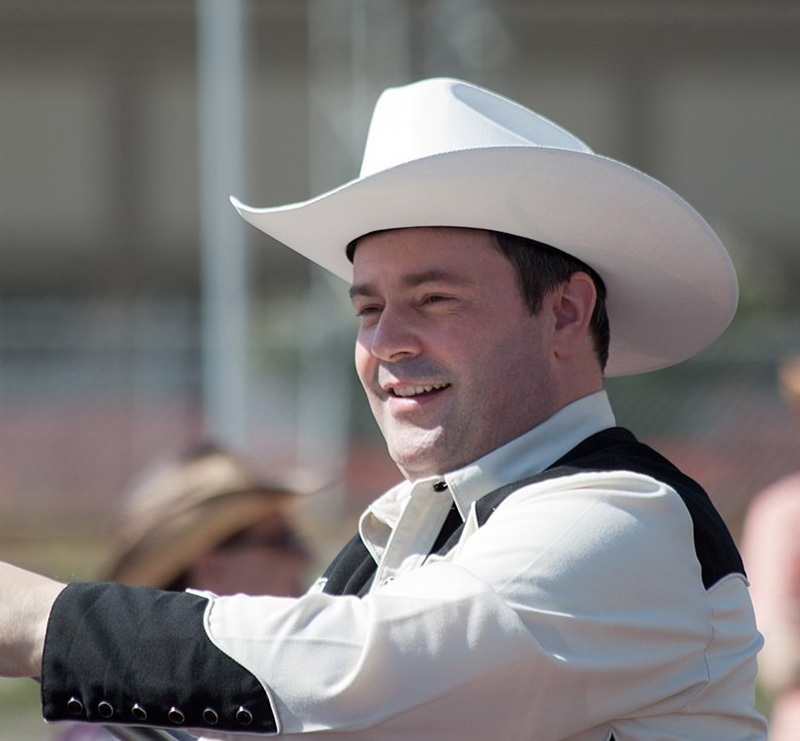582px version of JasonKenneyCowboyHatStampede.jpg