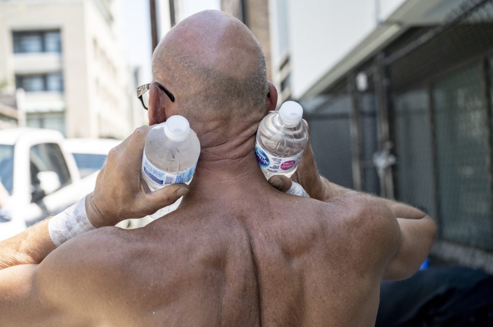 HeatWaveWaterBottlesShirtlessMan.jpeg