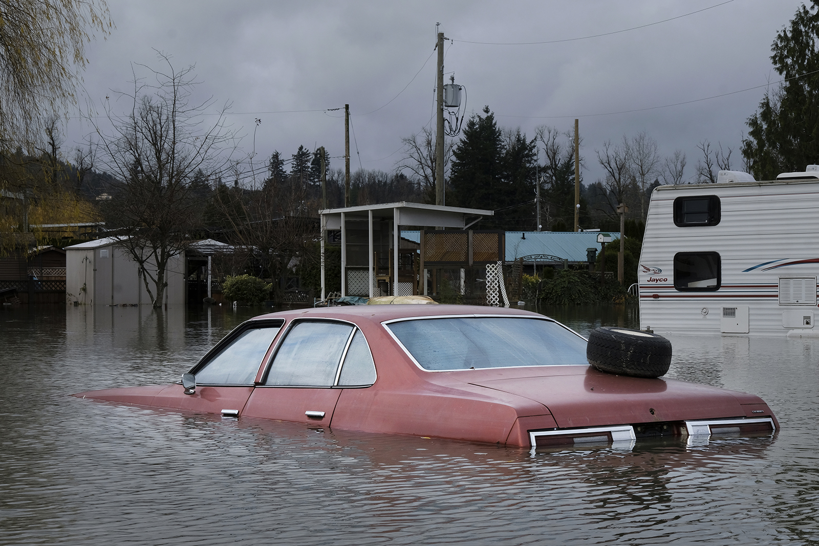 An old car submerged in water.