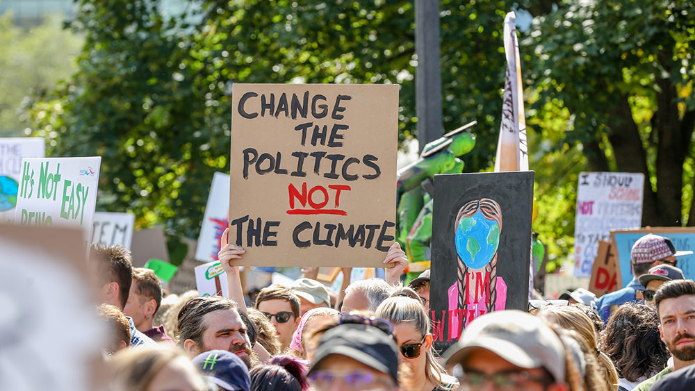 851px version of ClimateProtestChangePoliticsSign.jpg