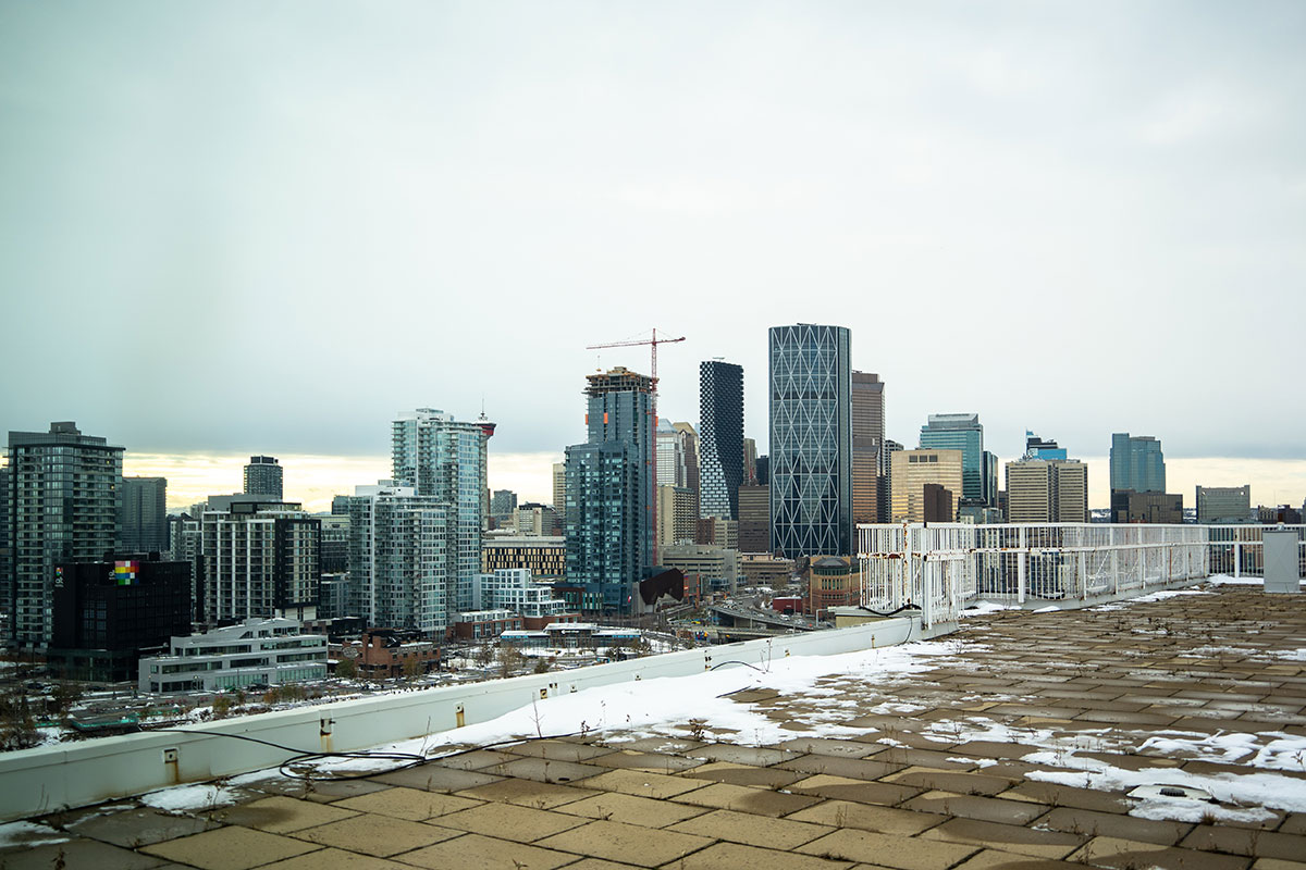 A panoramic view of downtown Calgary from an apartment rooftop in winter.