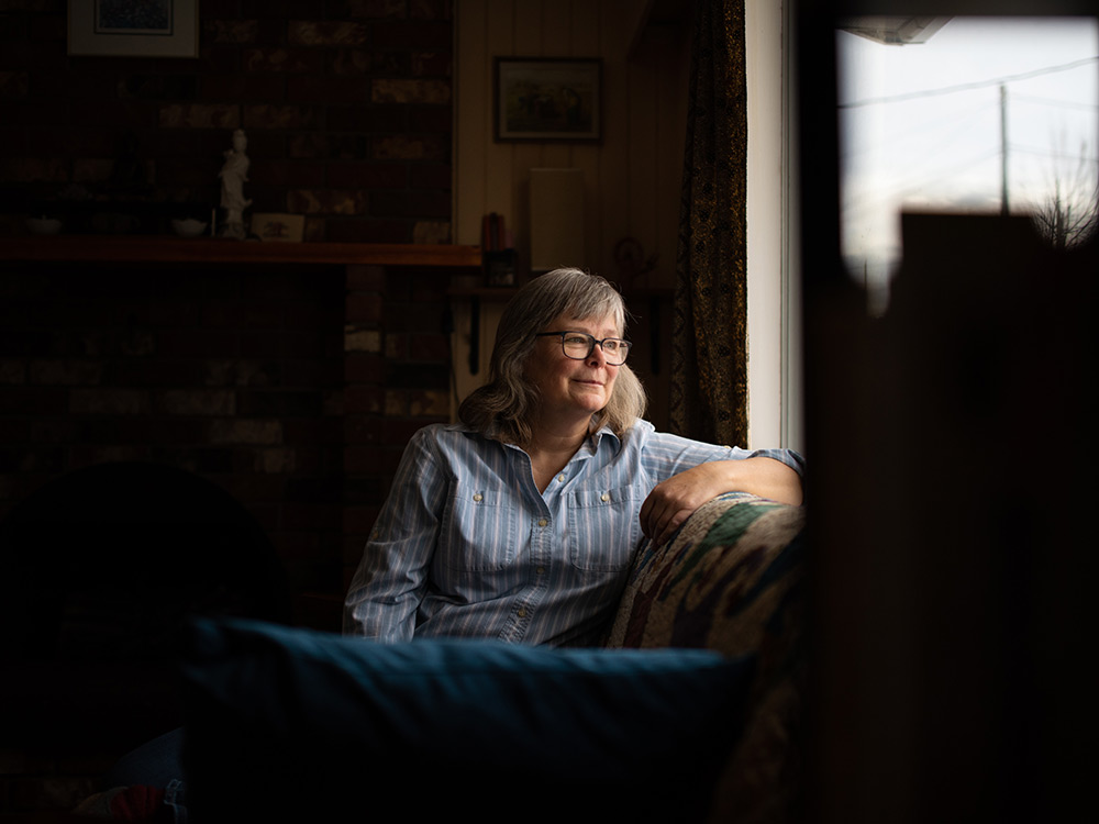 A woman sitting on a sofa.