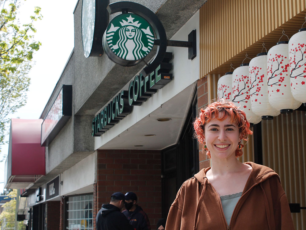 Fr&eacute;d&eacute;rique Martineau stands outside a Starbucks outlet.