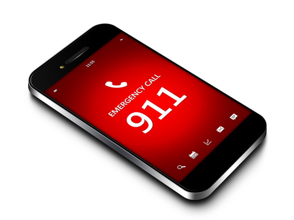 A cellphone on a white background. The screen reads, 'Emergency Call. 911.'
