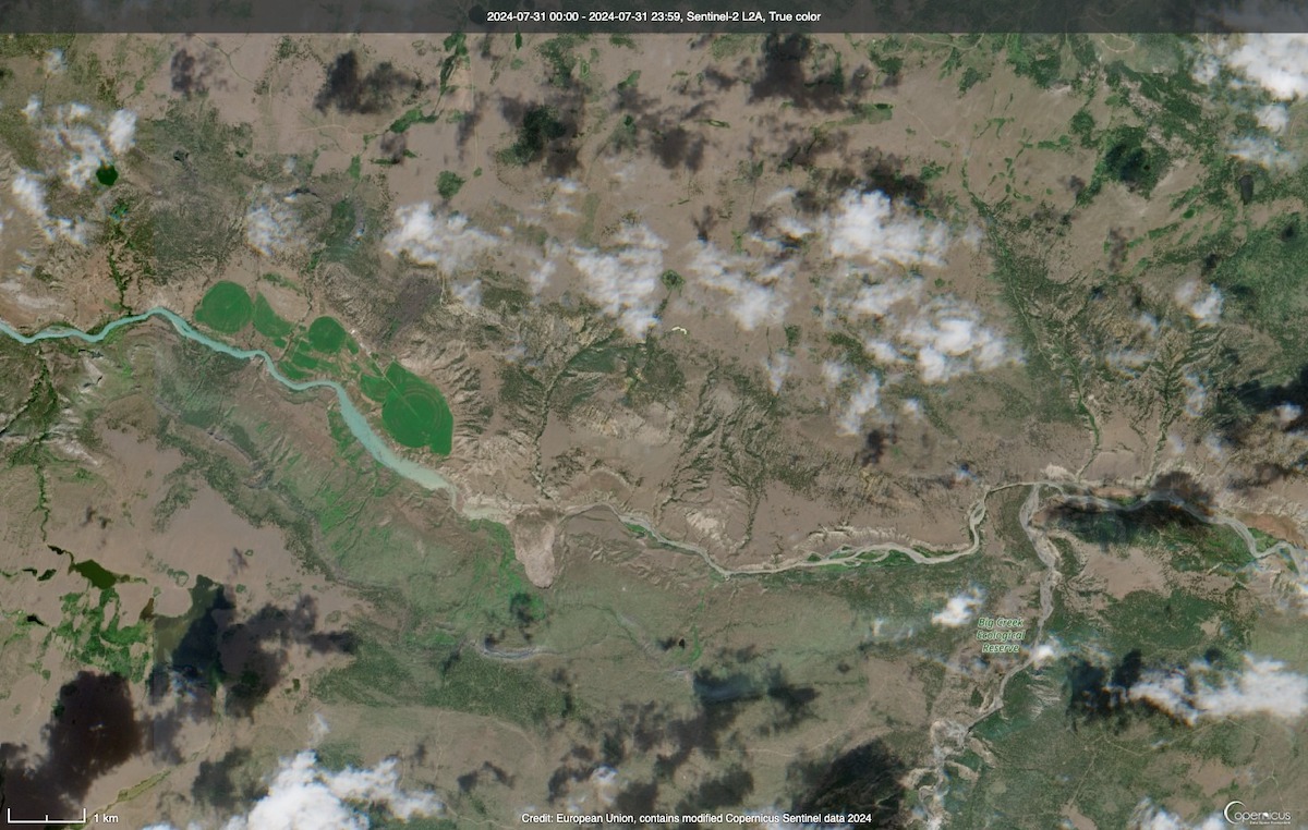 The landslide is visible in the satellite image. Upstream, to the left of it, the river is backing up and has widened significantly.