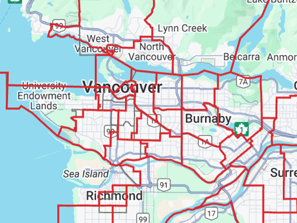 A green, grey and blue map of Vancouver and its surrounding municipalities is overlaid by red lines that show the new boundaries for ridings in the 2024 provincial election.