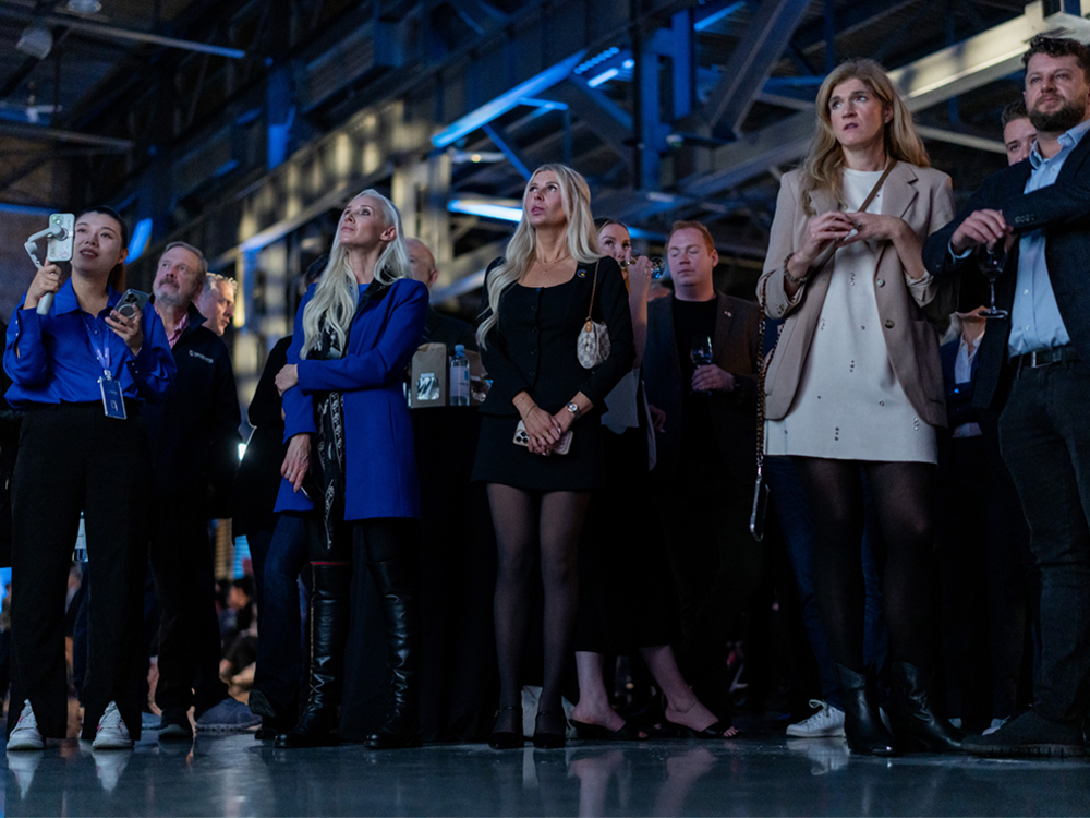 People wearing mostly blue and black look worried and nervous watching election results come in.