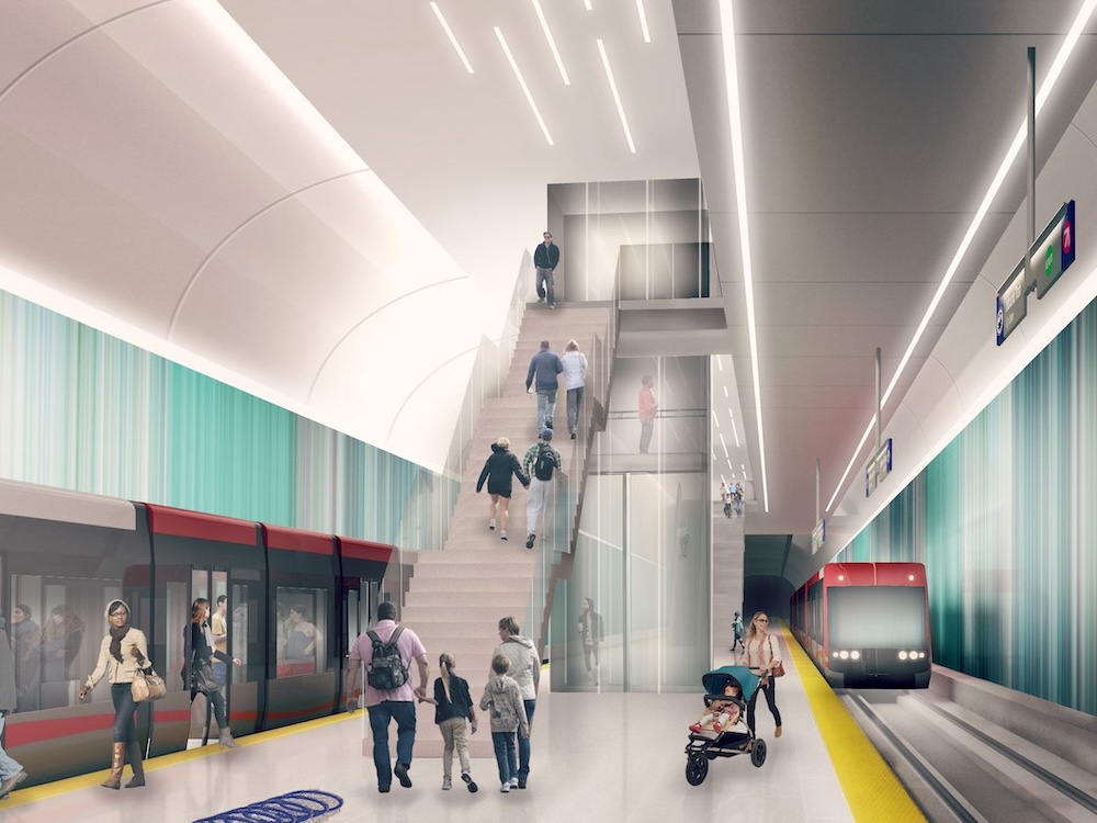 A rendering of a light-rail transit station showing trains on tracks to the left and right, and people walking up a staircase toward an upper level.