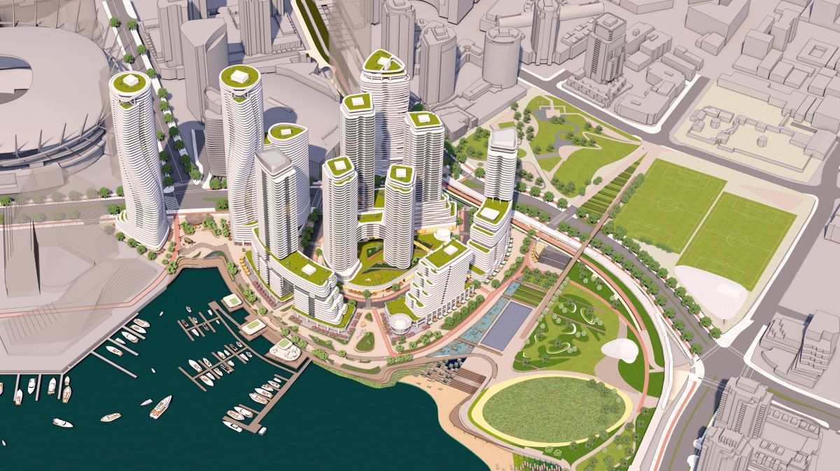 An artist&rsquo;s rendering shows an aerial view of a waterfront development with several highrise towers and various green spaces.