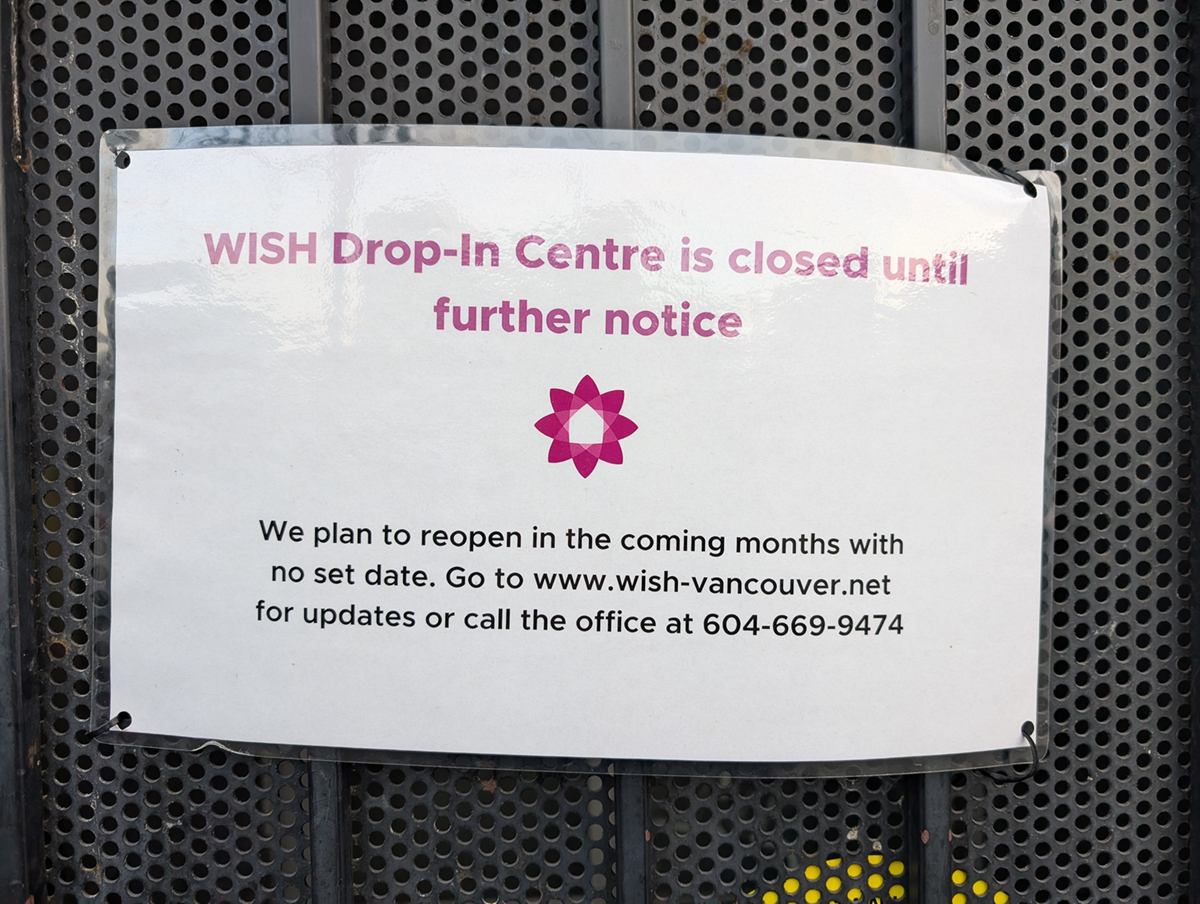 A sign reads, ‘WISH Drop-In Centre is closed until further notice.’