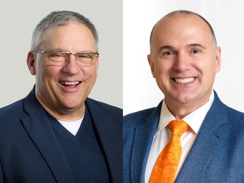 Two photos side by side. On the left, David Beckham is a light-skinned man with short grey hair and glasses, wearing a navy blue jacket. On the right, Colin Plant is a light-skinned man with thinning grey hair, wearing a blue jacket and orange tie.