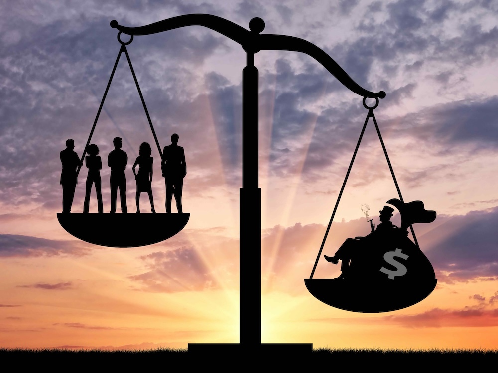 An image shows a traditional scale, with one rich person weighing more than five typical workers.
