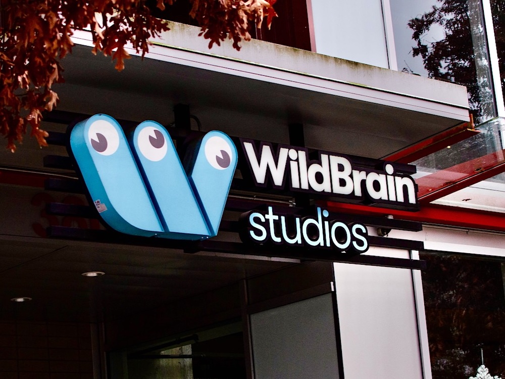 A two-storey office building in Vancouver that is decorated with a multicoloured mural.