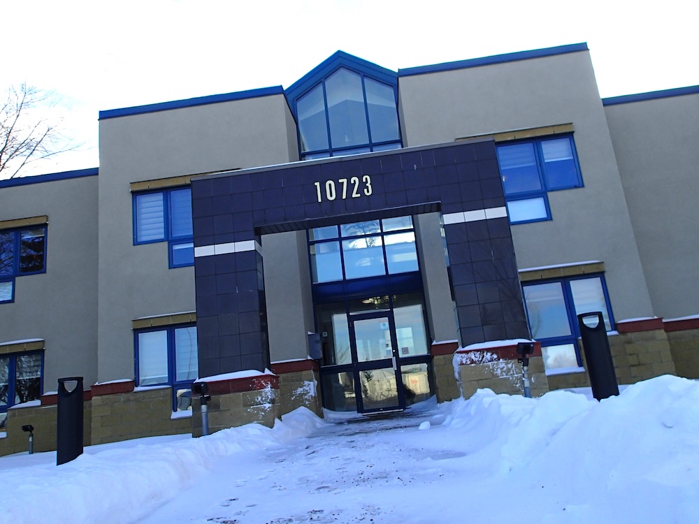 A three-storey office building in the snow.