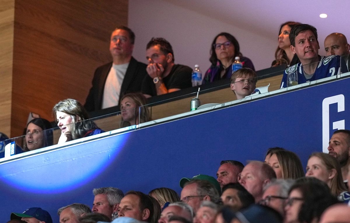 A group of people in a luxury box in the Edmonton arena.