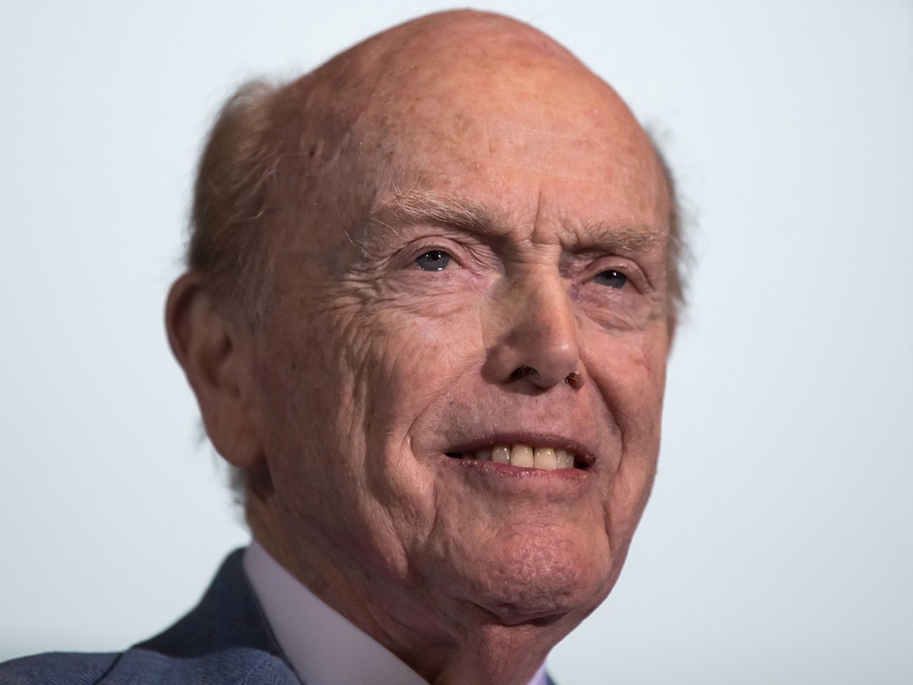 A 90-ish balding, light-skinned man.