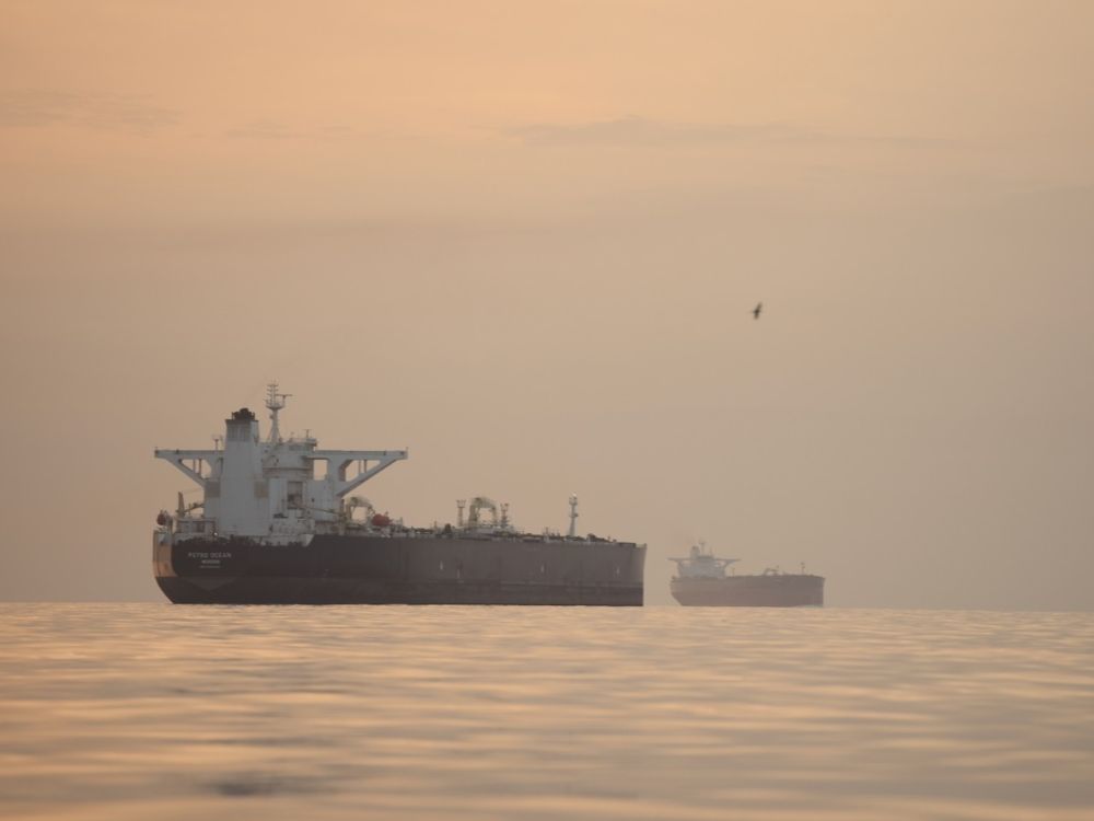 An oil tanker floats on the ocean.