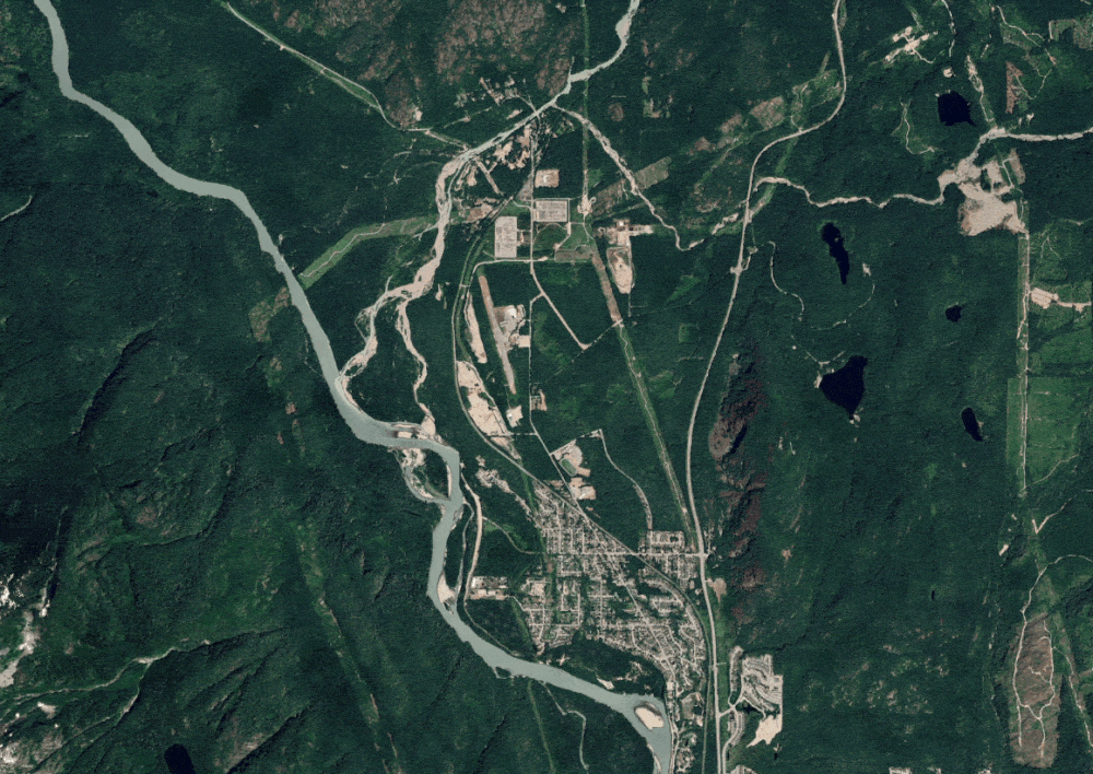 An aerial image of a largely mountainous, forested area is overlaid by a map showing hazards in different shades, reflecting the scale of the hazard.