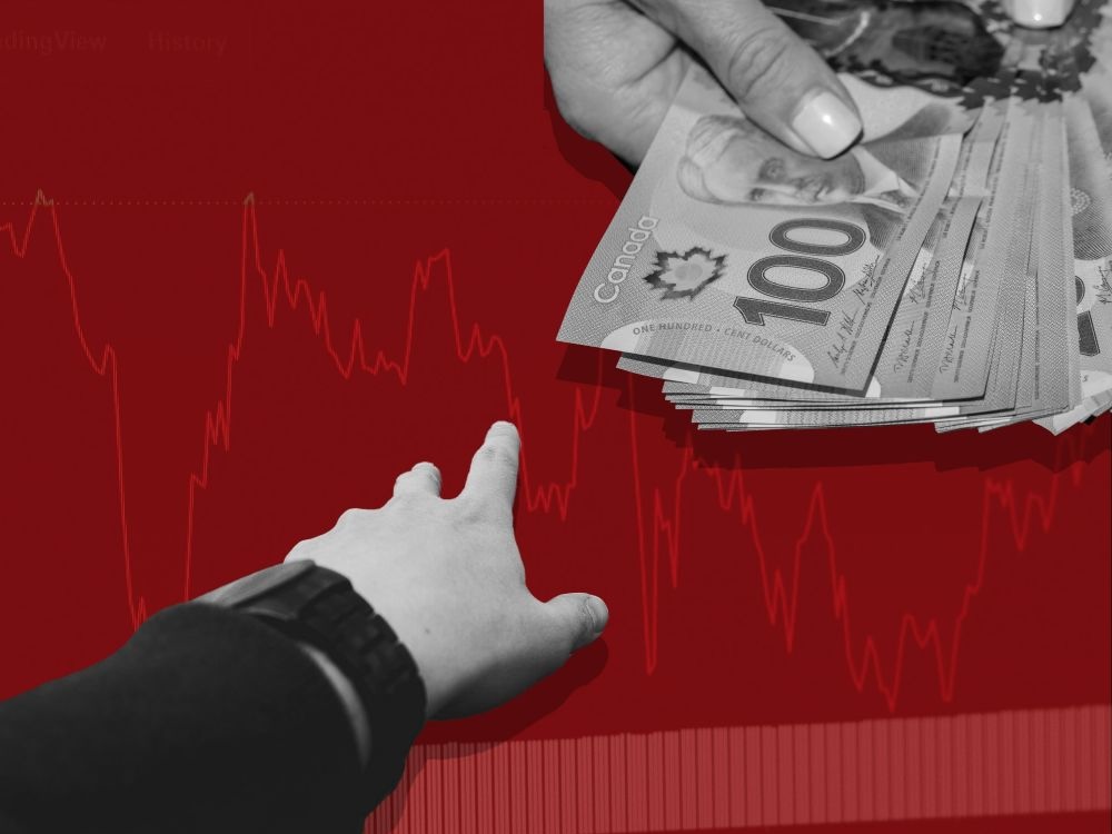 Over a red line-graph background, a hand holds a wad of $100 bills in the top right of the frame while another hand reachers toward it from the bottom left.