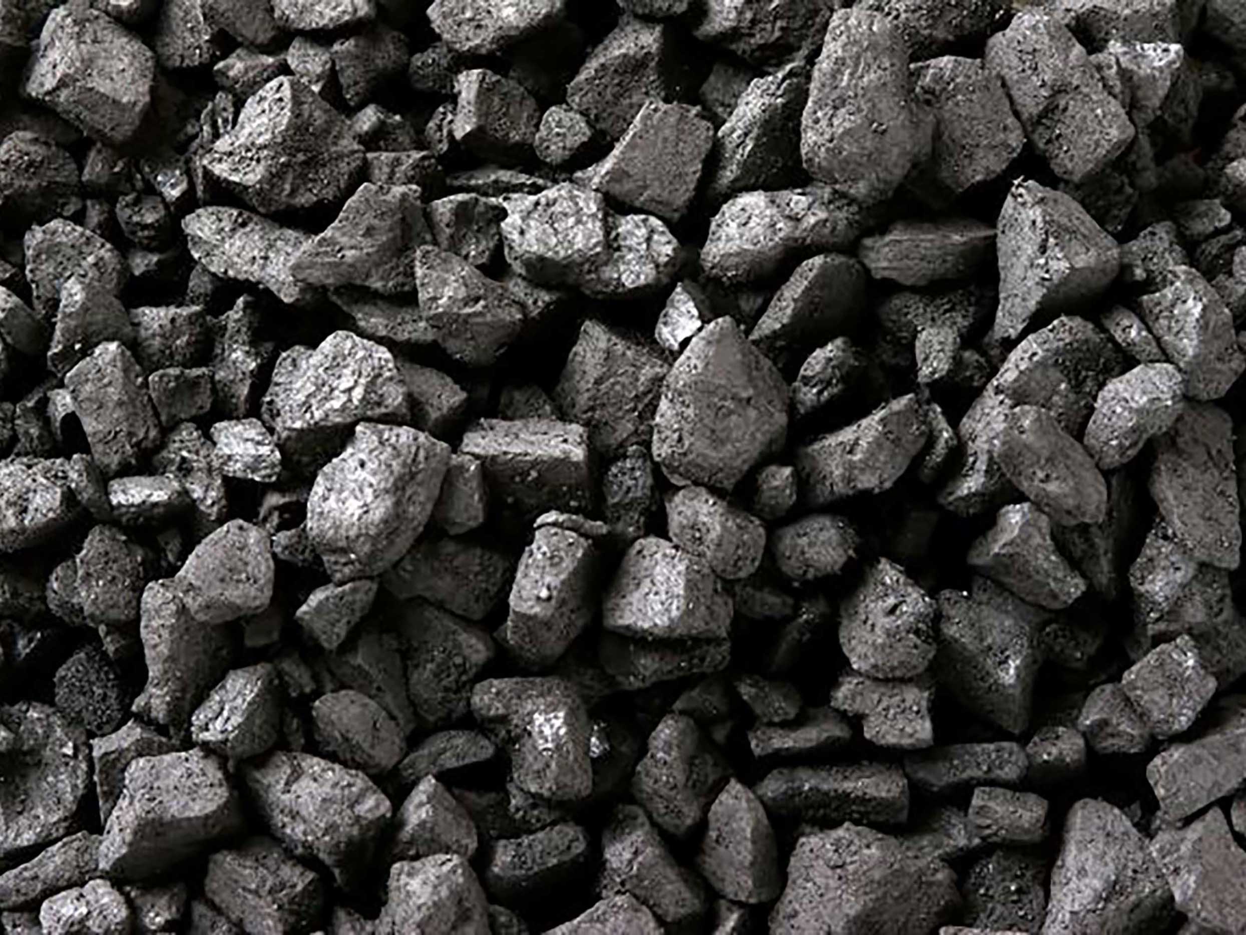 A closeup of a pile of dark grey coal.