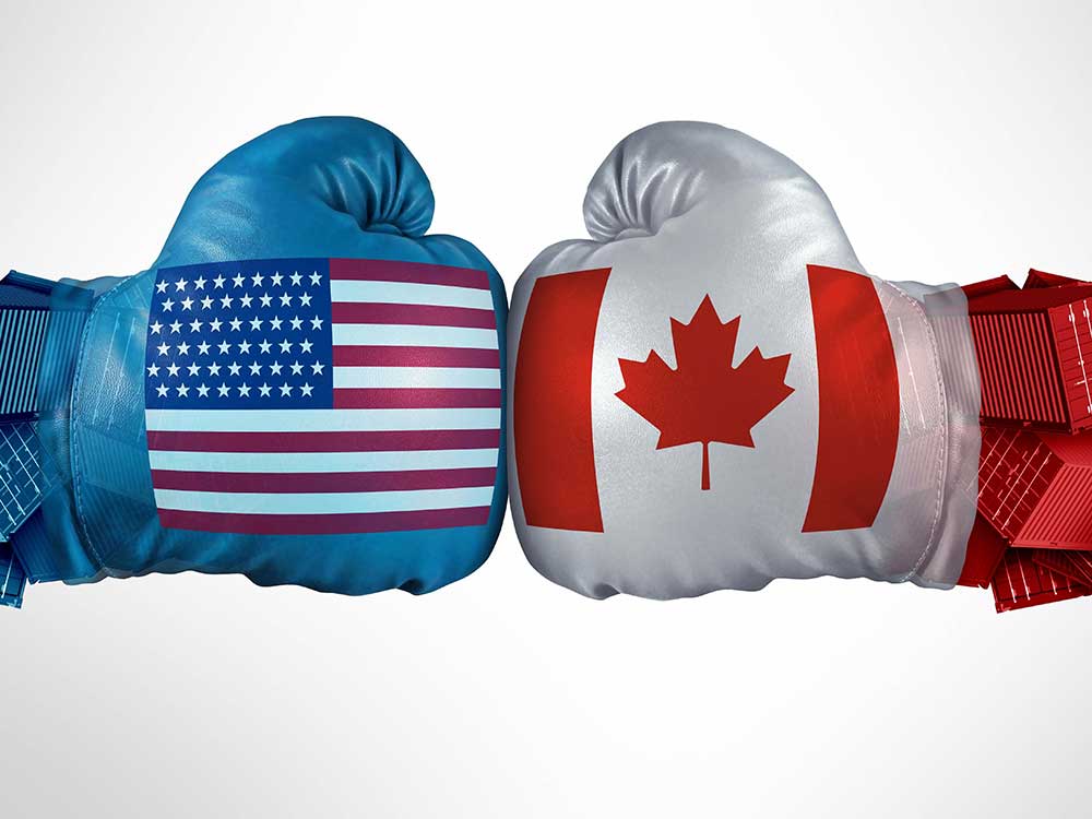An illustration shows two boxing gloves ouching, one with the U.S. flag and one with the Canadian flag.